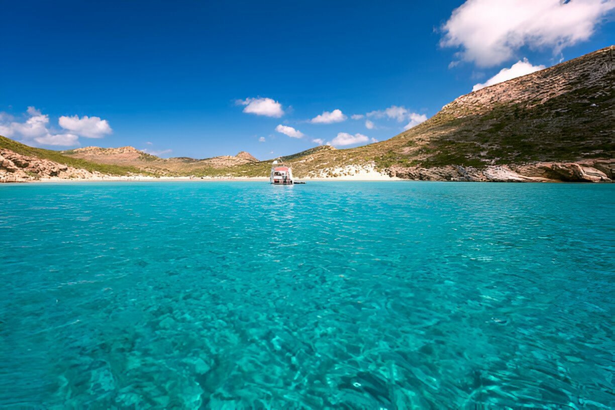 Crystal clear blue water near a serene beach in Antiparos Island.